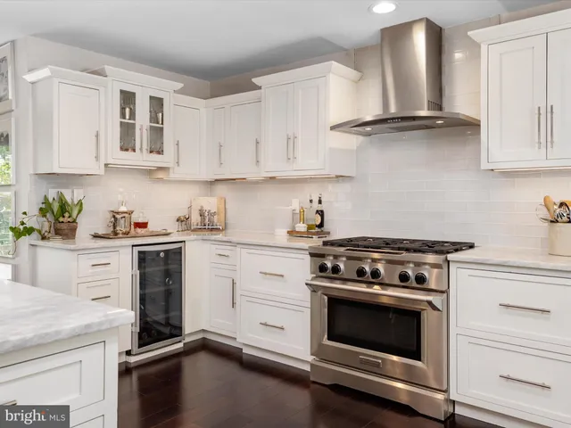 a spacious bedroom with a bed and a chair