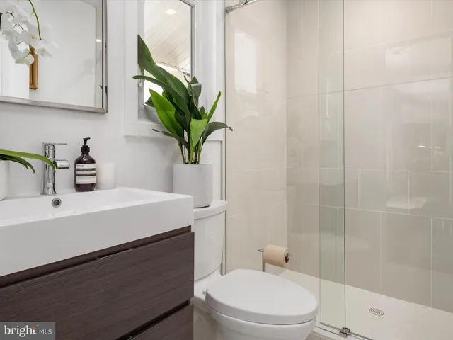 a spacious bedroom with a bed and a window