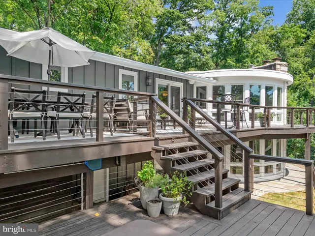 an outdoor space with furniture and garden