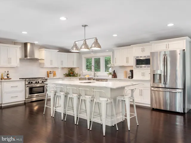 a bedroom with a bed and a potted plant