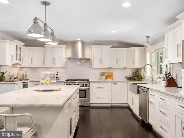 a bathroom with a double vanity sink mirror and shower