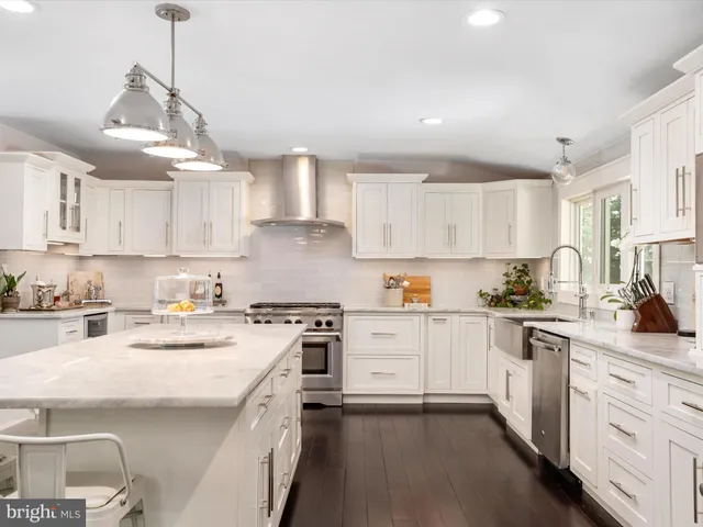 a bathroom with a double vanity sink mirror and shower