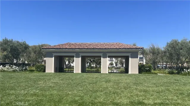 a view of a house with yard and entertaining space