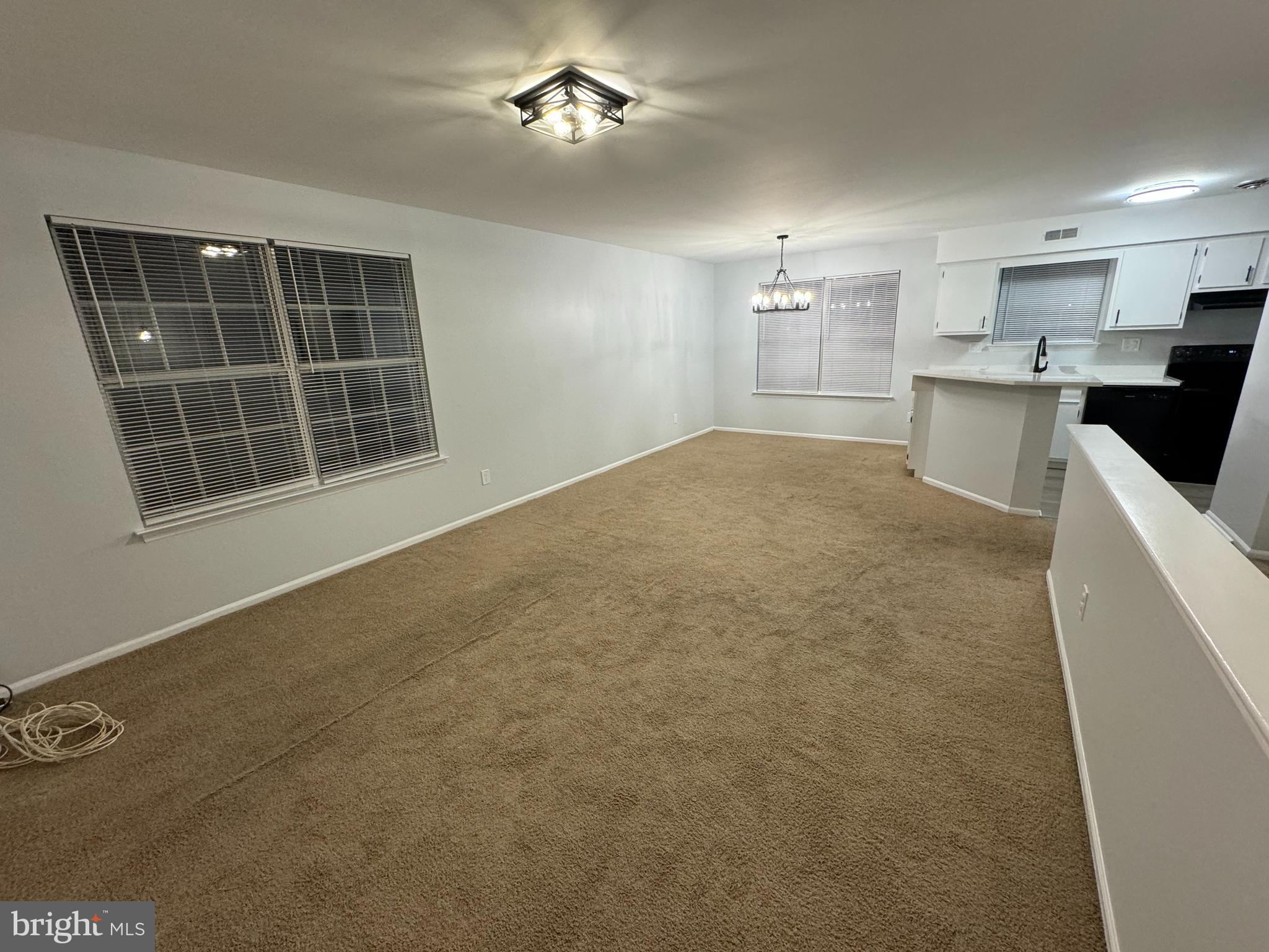 1768 North Dove Road, Unit B Yardley, PA 19067 - Photo 2 of 6 a view of an empty room with a window