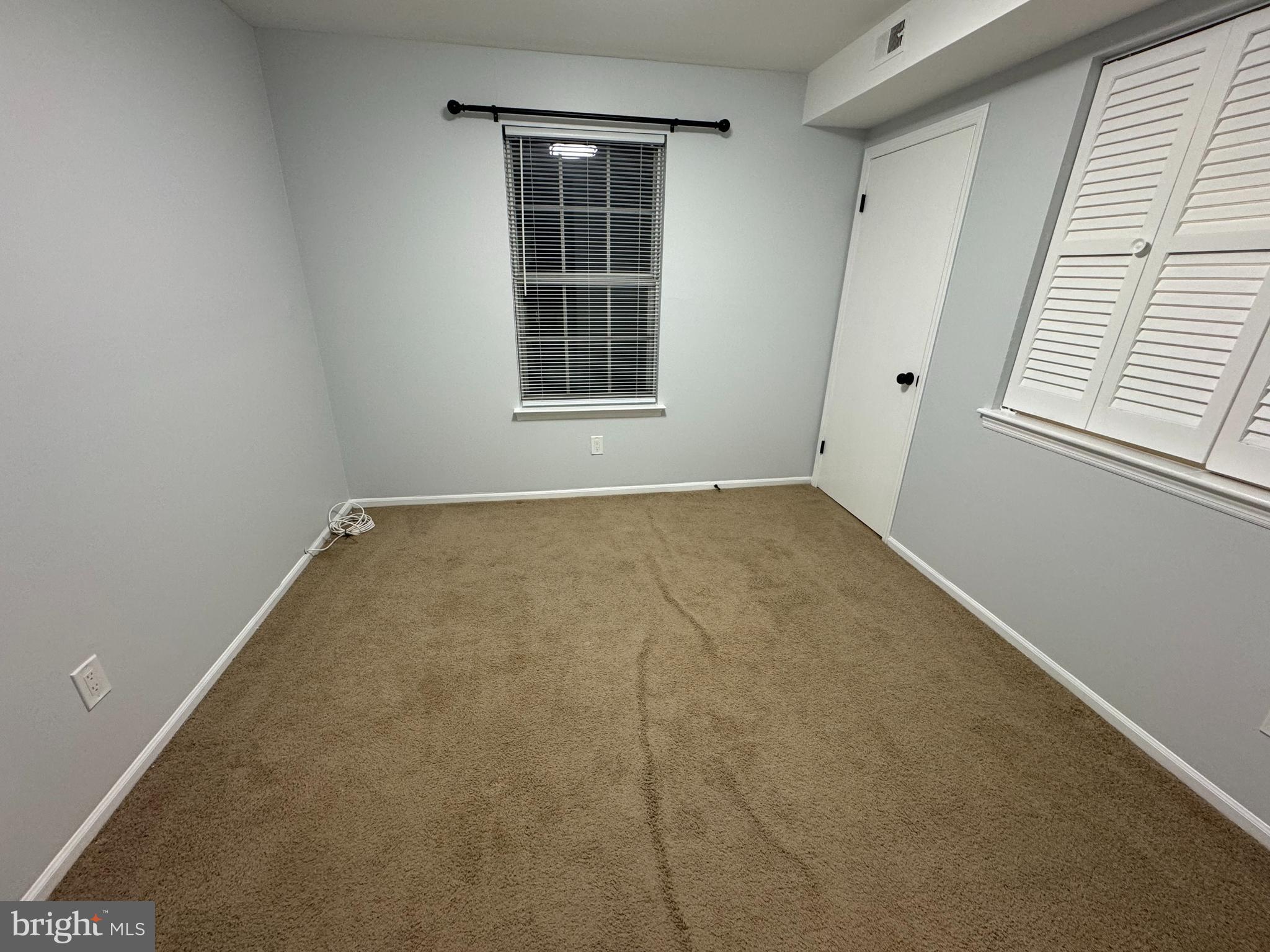 1768 North Dove Road, Unit B Yardley, PA 19067 - Photo 3 of 6 an empty room with windows