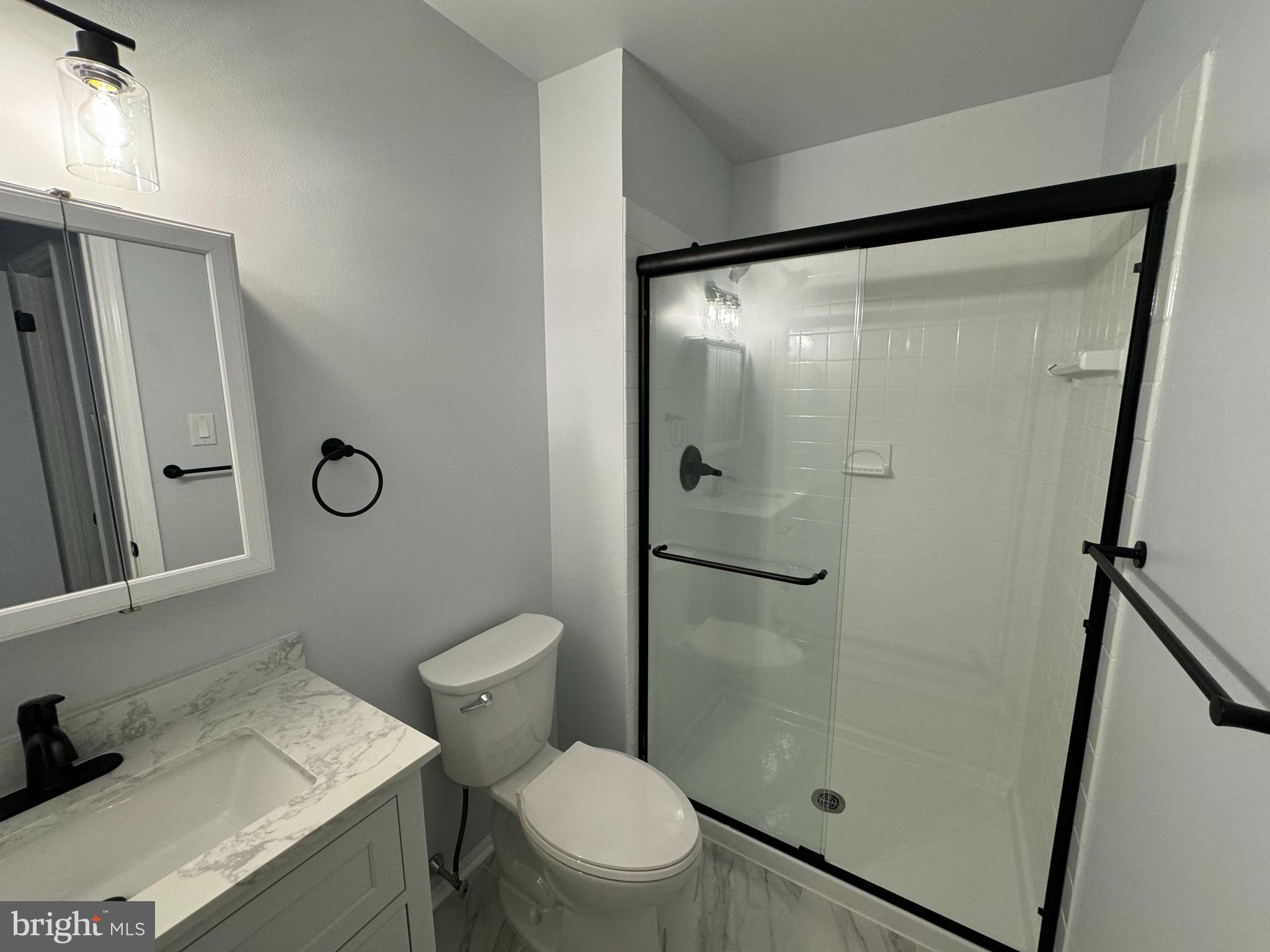 1768 North Dove Road, Unit B Yardley, PA 19067 - Photo 5 of 6 a bathroom with a toilet and a shower