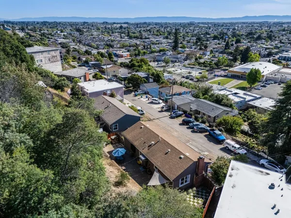 an aerial view of a house with a garden