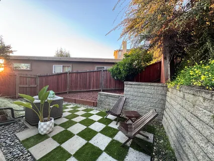 a view of a backyard with a patio