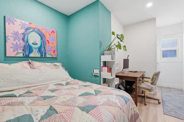 a bedroom with a bed and furniture