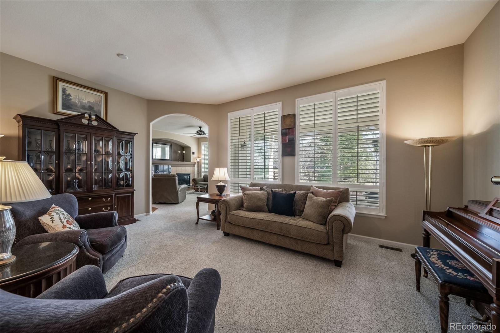 16598 Hitching Post Circle Parker, CO 80134 - Photo 7 of 50 a living room with furniture and a large window