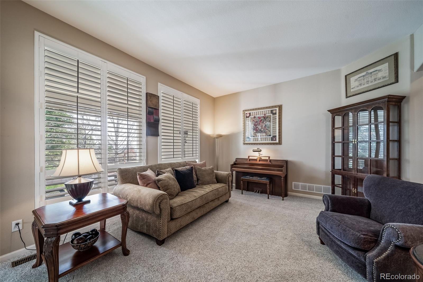 16598 Hitching Post Circle Parker, CO 80134 - Photo 8 of 50 a living room with furniture and a large window