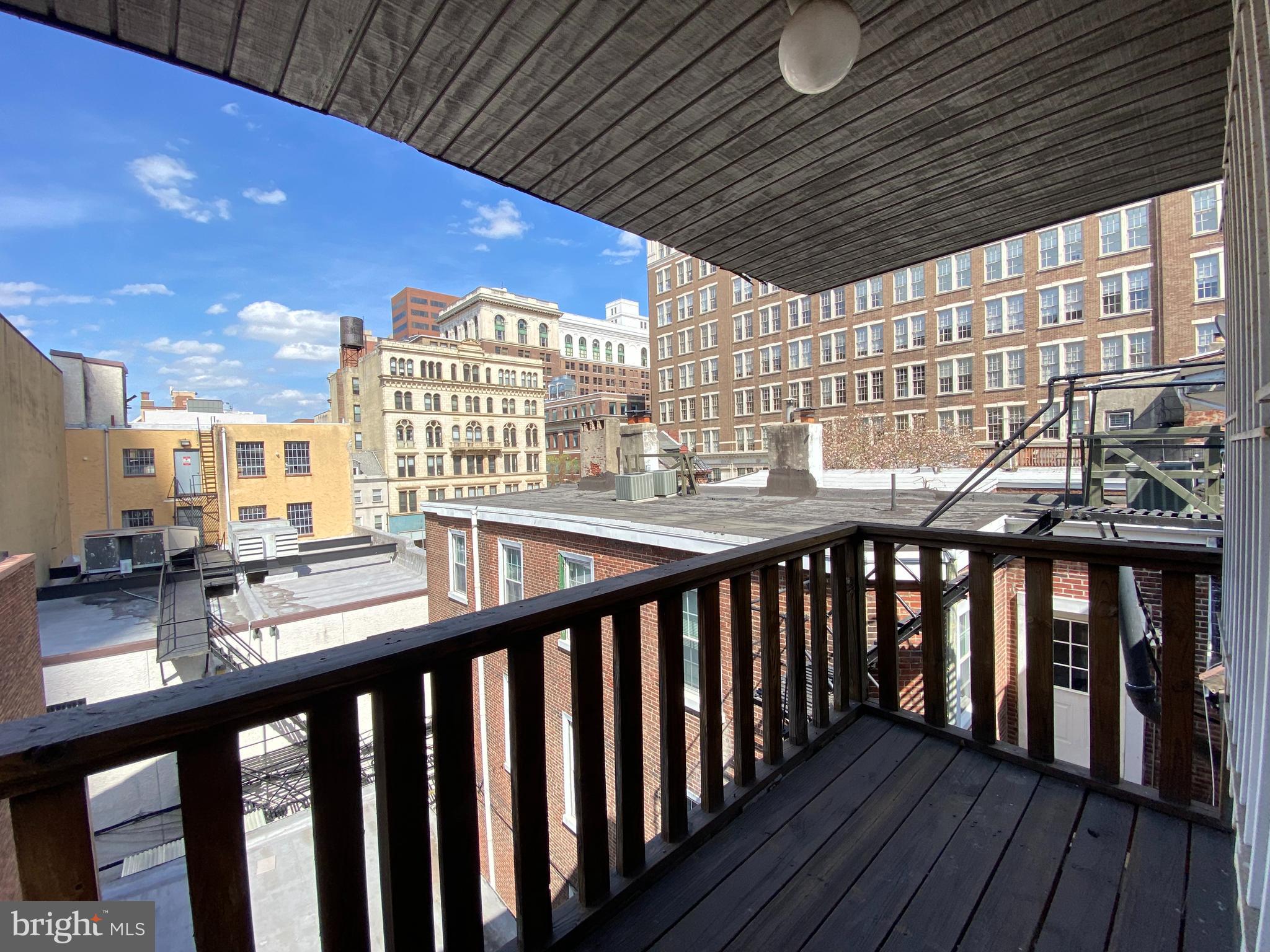 713 Walnut Street, Unit 3F Philadelphia, PA 19106 - Photo 11 of 12 a view of balcony with wooden floor and seating space