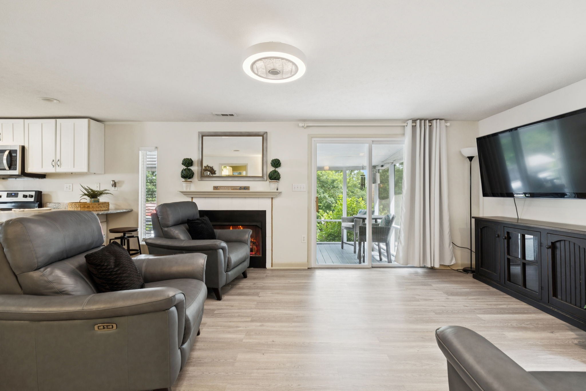 617 Still Point Road Smithville, TN 37166 - Photo 34 of 72 a living room with furniture and a flat screen tv