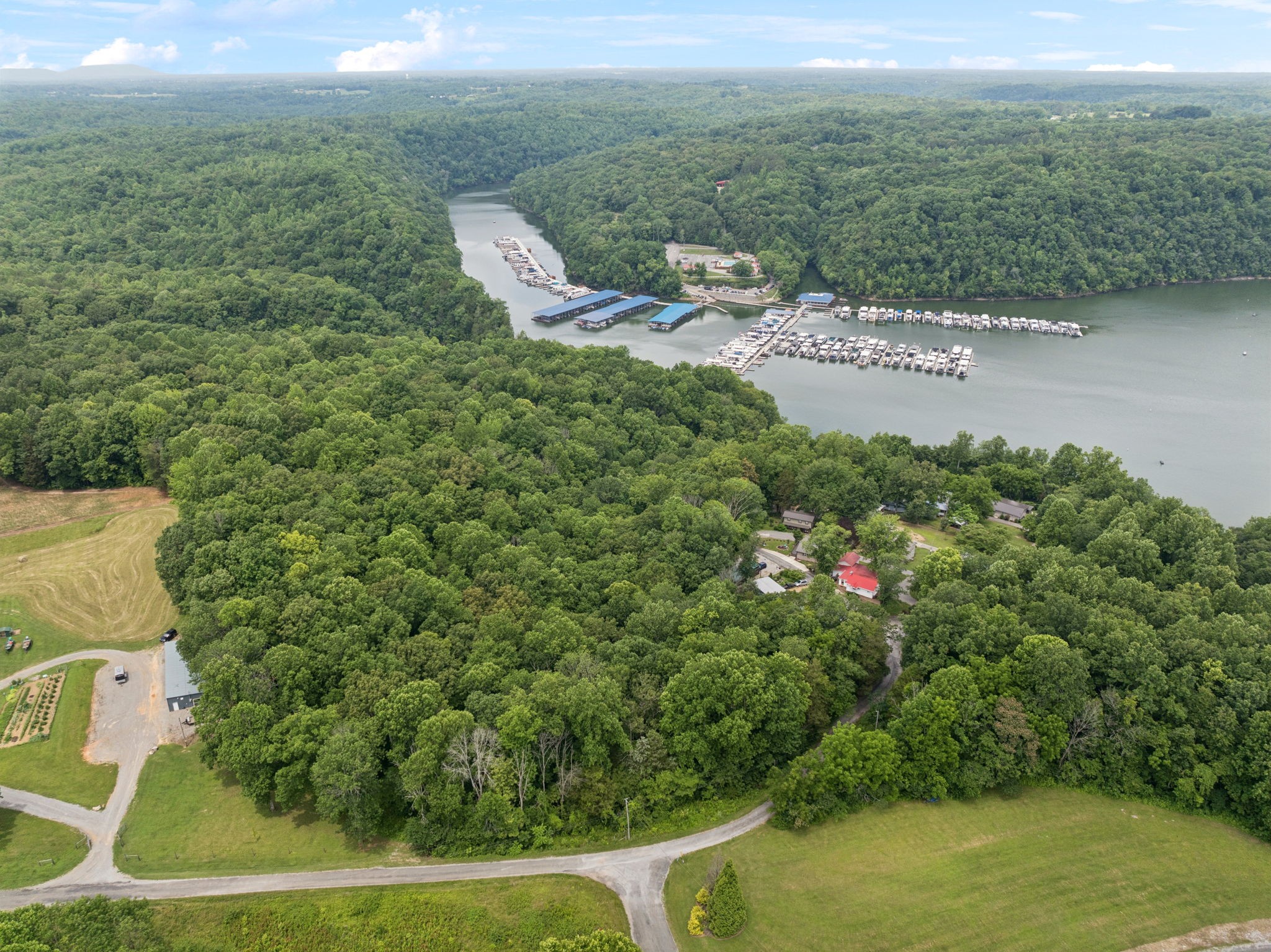 617 Still Point Road Smithville, TN 37166 - Photo 63 of 72 a view of a lake with a building in the background
