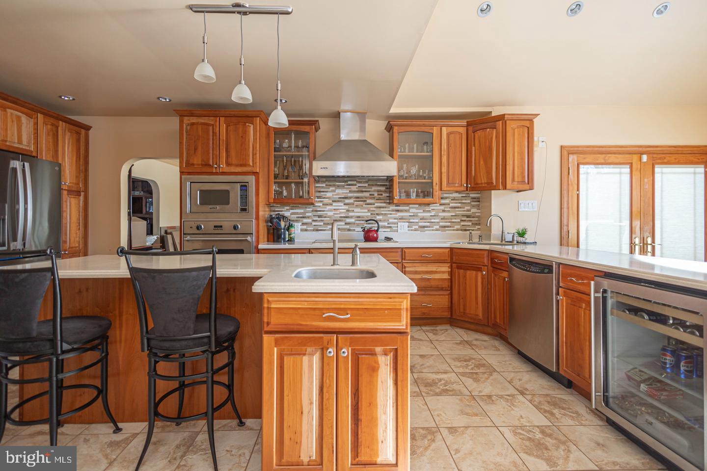 612 Double Woods Road Langhorne, PA 19047 - Photo 12 of 44 a kitchen with stainless steel appliances a sink stove and cabinets