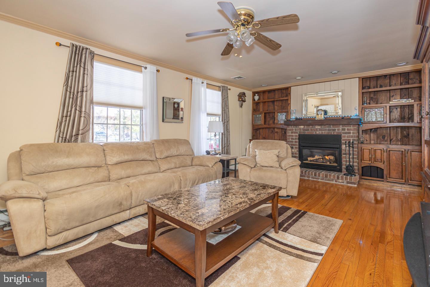 612 Double Woods Road Langhorne, PA 19047 - Photo 18 of 44 a living room with furniture fireplace and flat screen tv