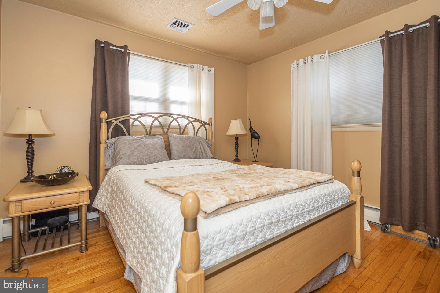 612 Double Woods Road Langhorne, PA 19047 - Photo 28 of 44 a bedroom with a bed and wooden floor