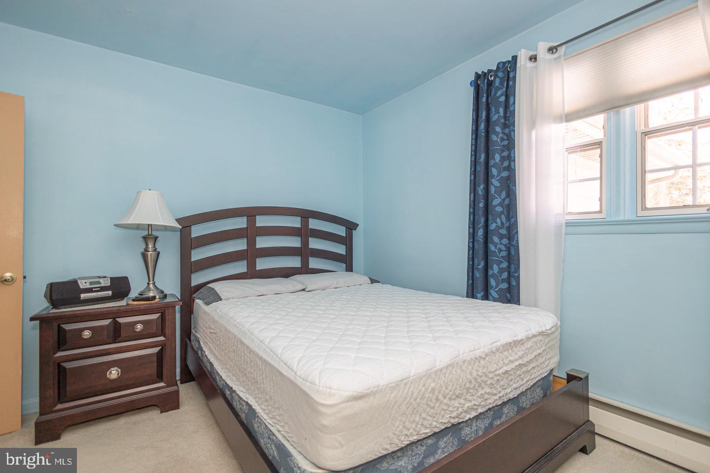 612 Double Woods Road Langhorne, PA 19047 - Photo 29 of 44 a bedroom with a bed and a tv