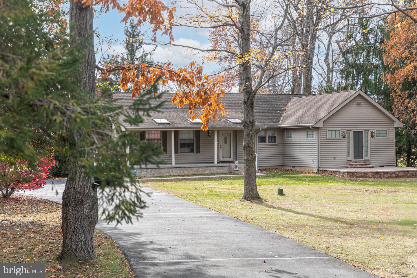 612 Double Woods Road Langhorne, PA 19047 - Photo 3 of 44 a view of house with swimming pool and a yard with trees