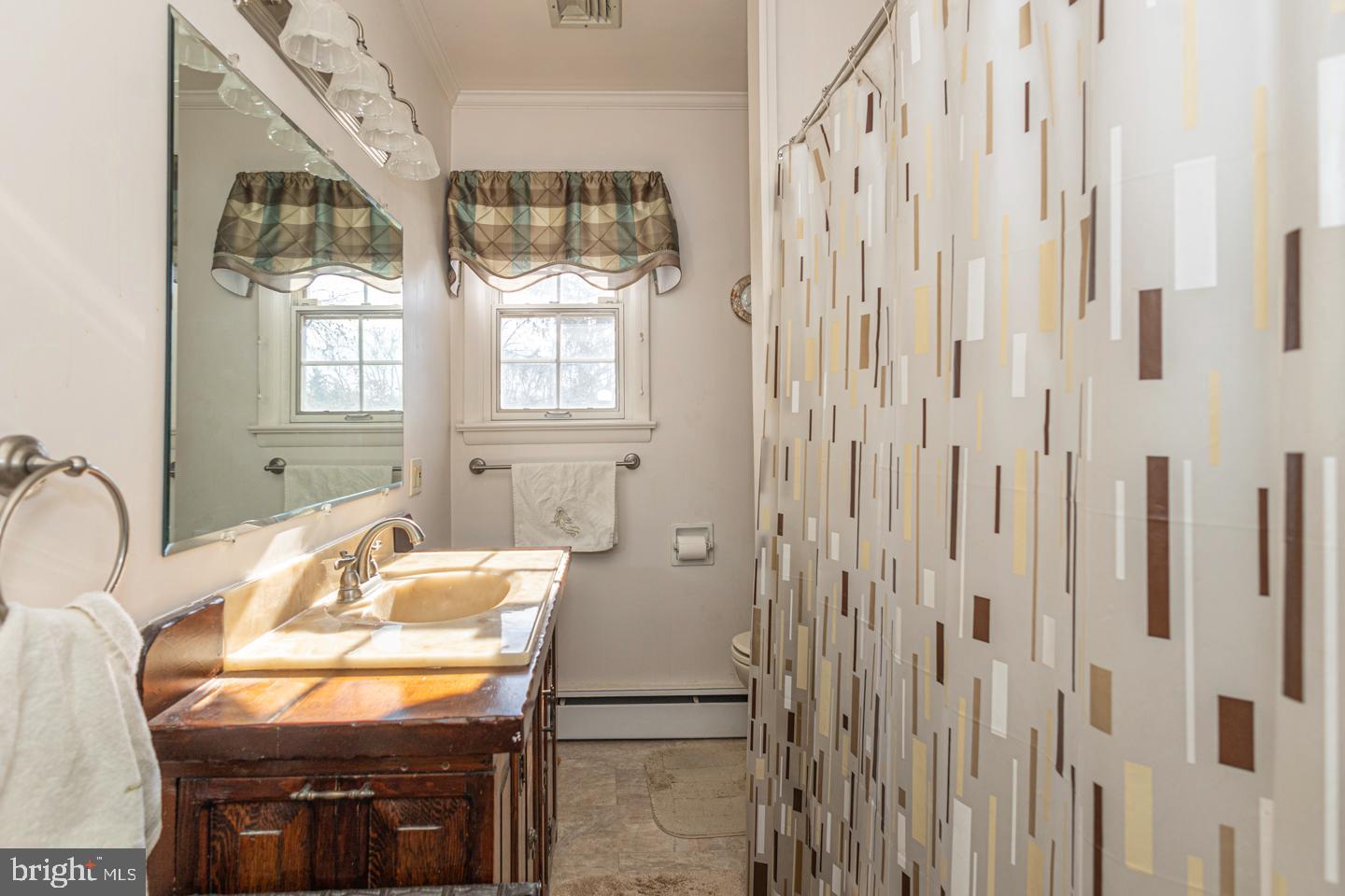612 Double Woods Road Langhorne, PA 19047 - Photo 31 of 44 a bathroom with a sink a mirror and a shower