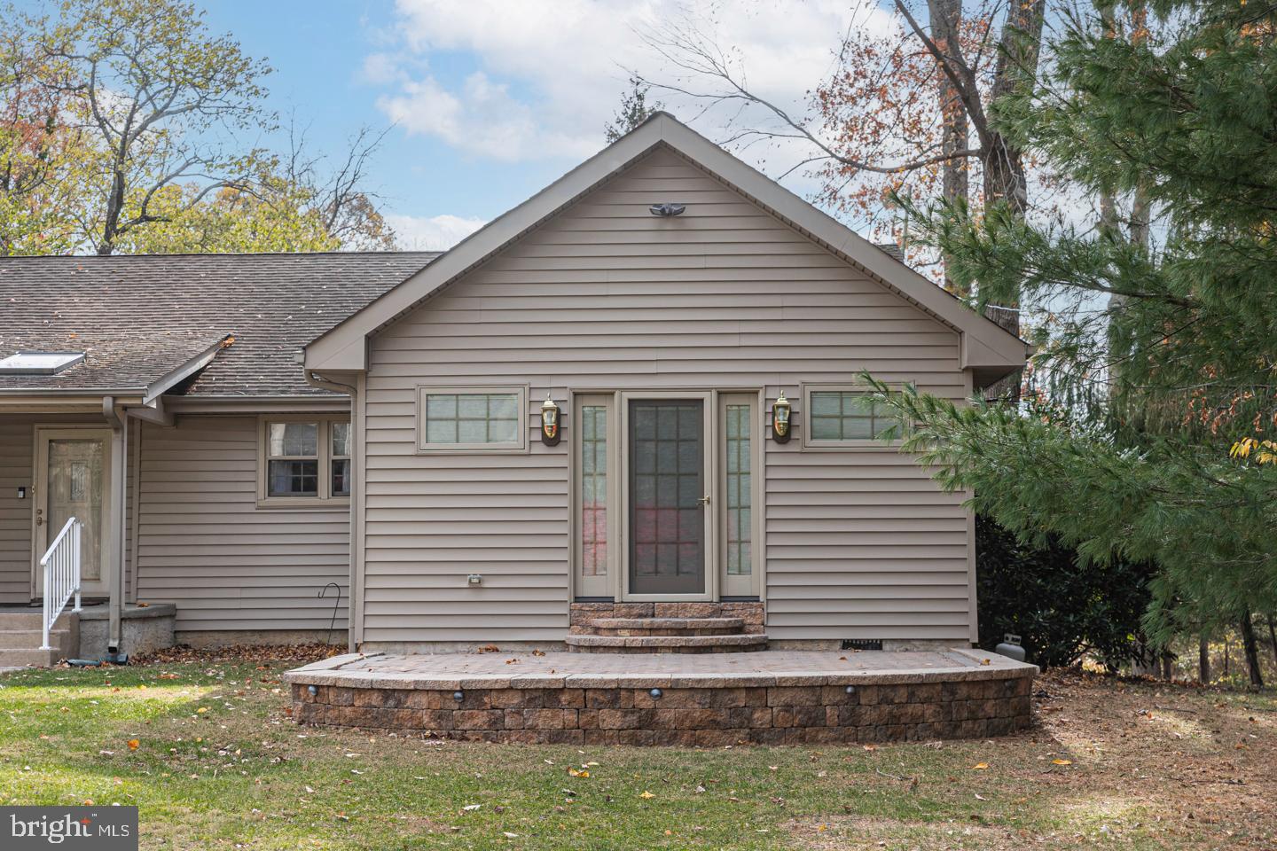 612 Double Woods Road Langhorne, PA 19047 - Photo 5 of 44 a view of a house with a small yard and a large tree in it