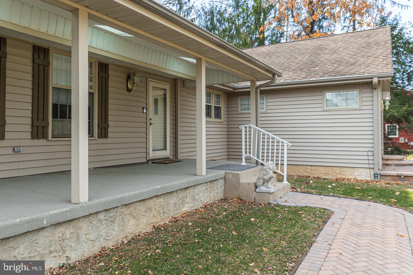 612 Double Woods Road Langhorne, PA 19047 - Photo 6 of 44 a view of a house with a door and wooden bench