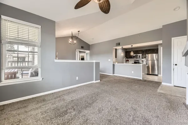 a kitchen with stainless steel appliances a refrigerator and a stove top oven