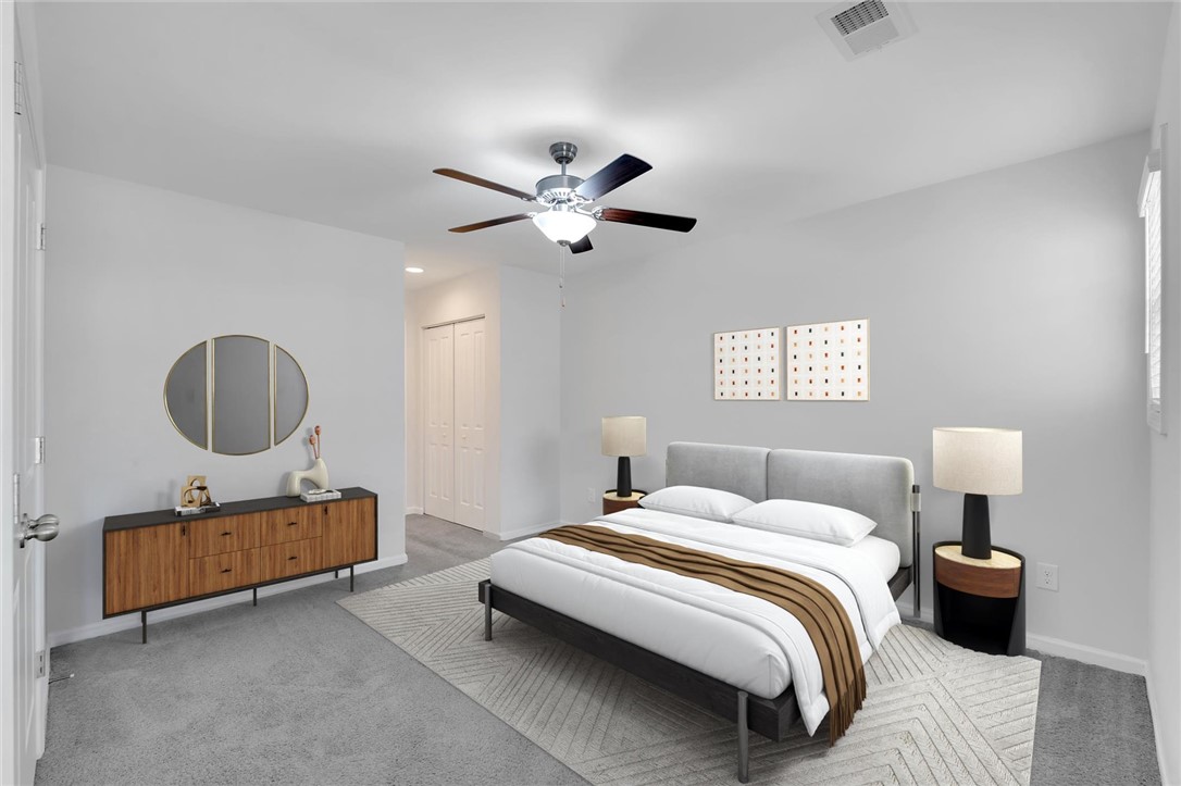 215 Royal Way Pendleton, SC 29670 - Photo 12 of 31 This virtually staged main floor primary bedroom offers a tranquil retreat with soft carpet and a convenient closet.