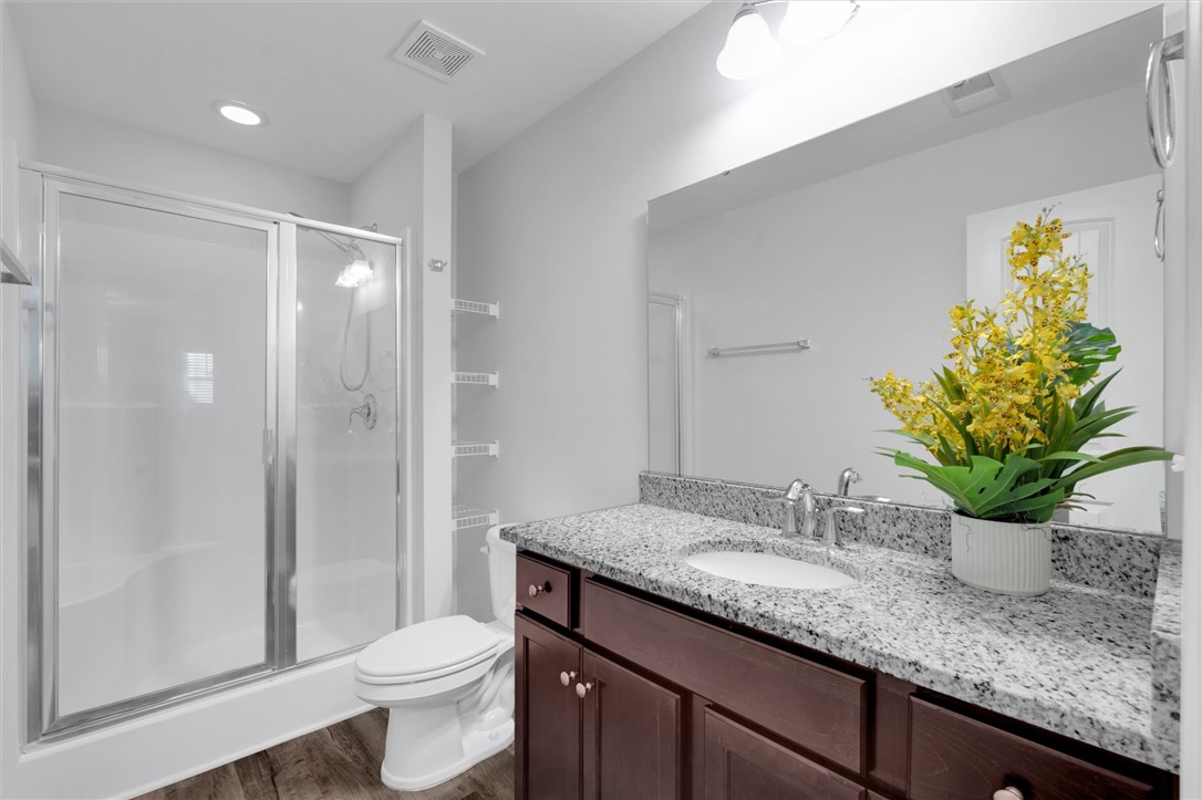 215 Royal Way Pendleton, SC 29670 - Photo 15 of 31 This sleek bathroom features a modern vanity and a spacious glass-enclosed shower.