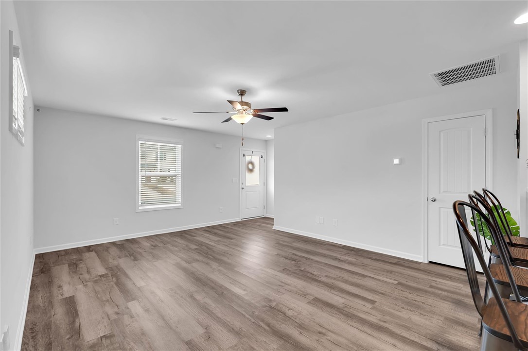 215 Royal Way Pendleton, SC 29670 - Photo 5 of 31 This bright living area features elegant flooring and abundant natural light.