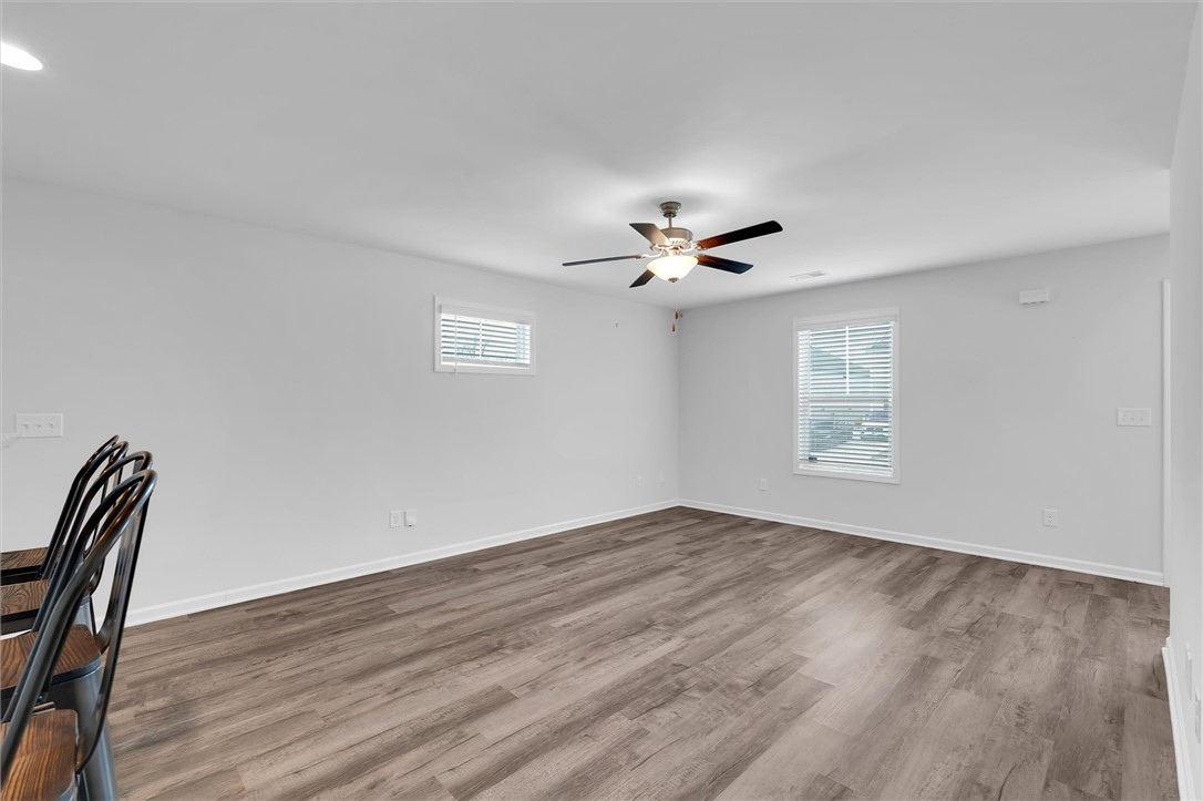 215 Royal Way Pendleton, SC 29670 - Photo 6 of 31 This bright, airy room features durable flooring, offering a versatile space for living or dining.