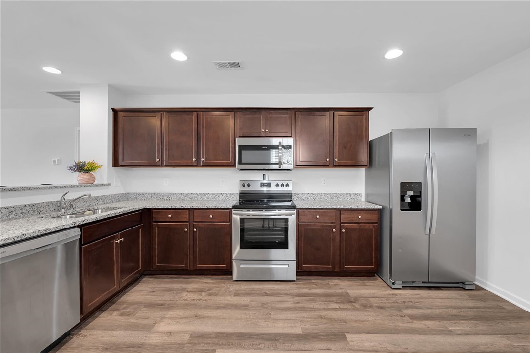 215 Royal Way Pendleton, SC 29670 - Photo 8 of 31 This spacious kitchen offers ample cabinetry, modern appliances, and durable countertops for everyday living.