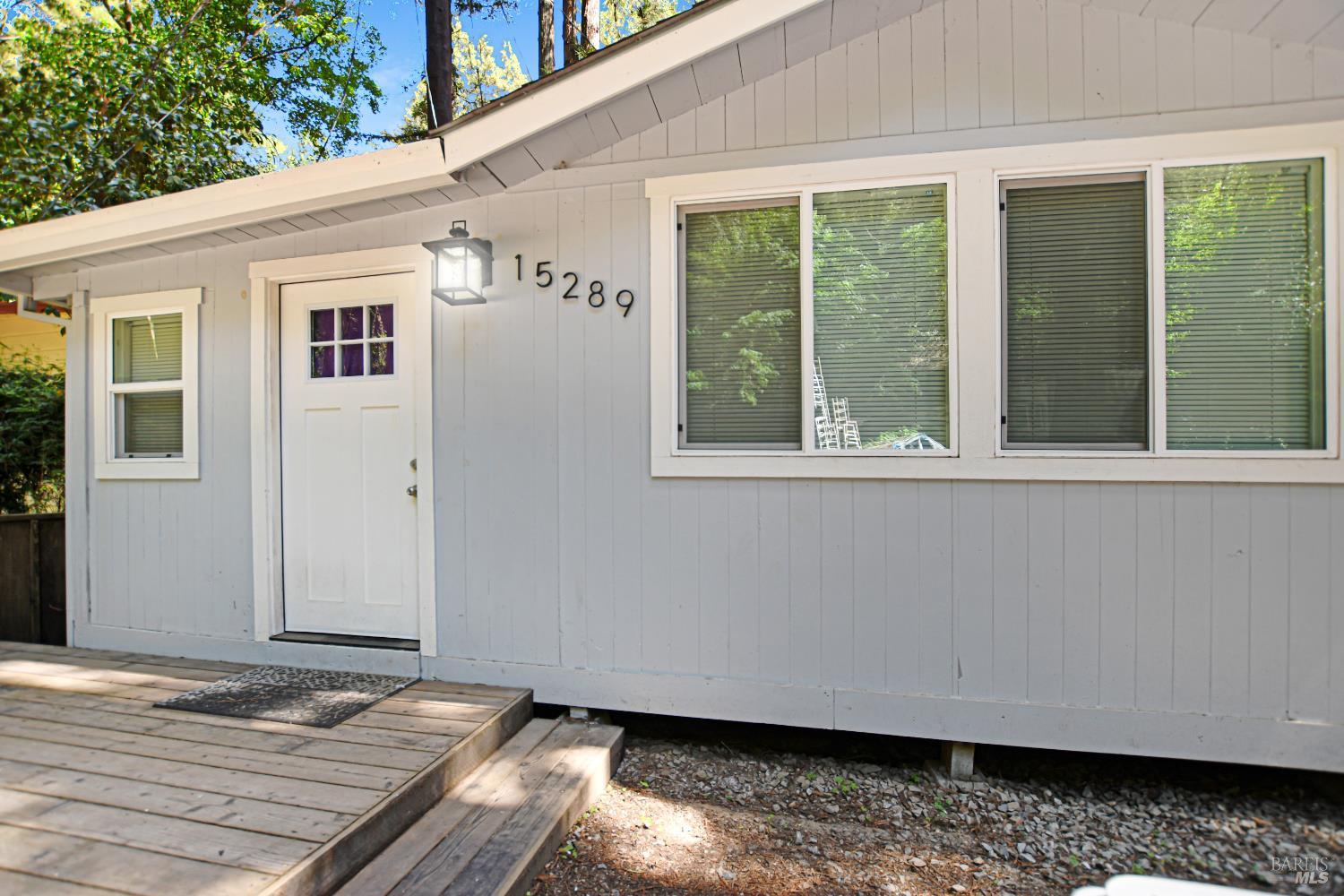 a view of backyard with deck