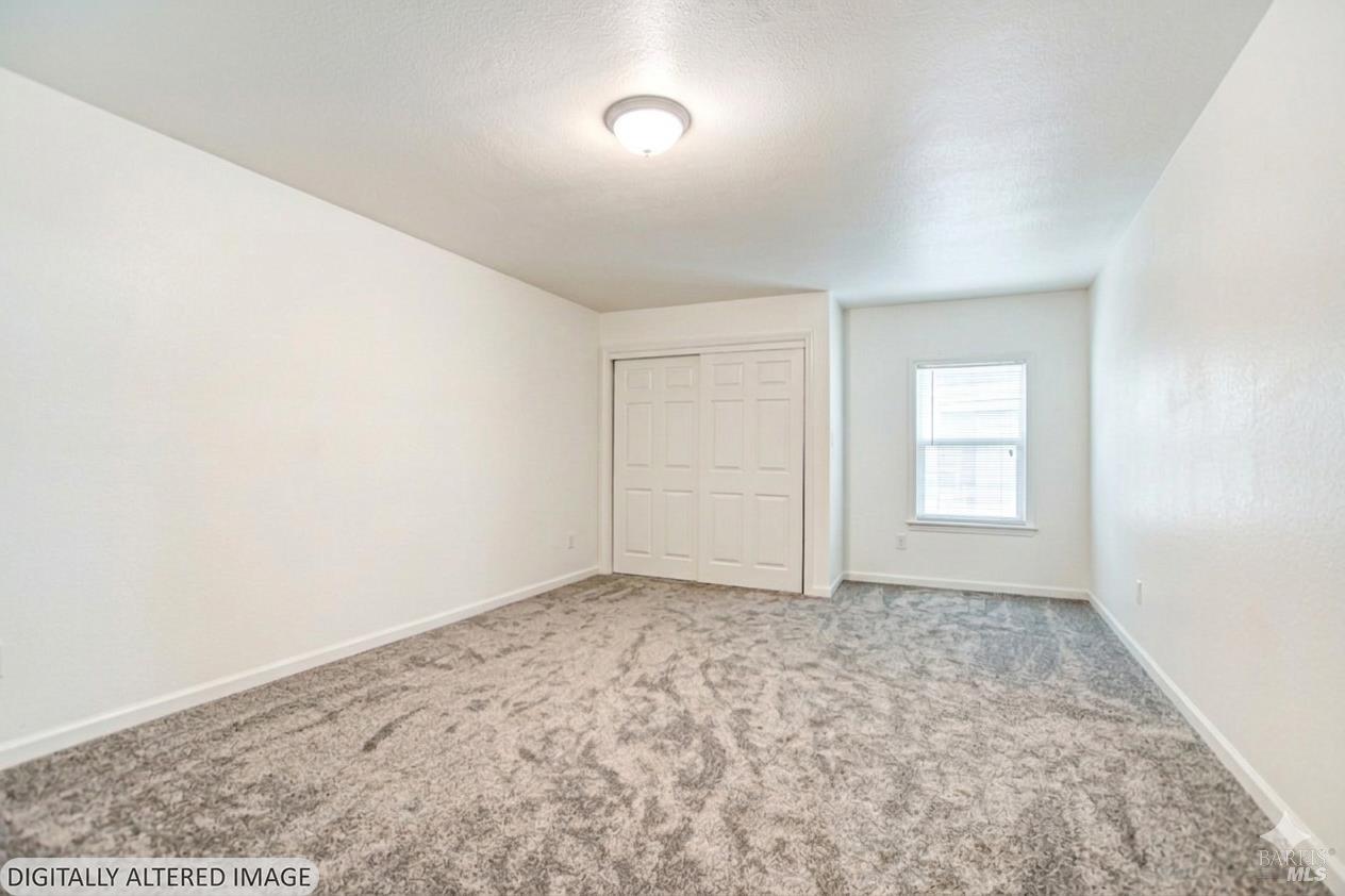 15289 Willow Road Guerneville, CA 95446 - Photo 11 of 22 an empty room with a window