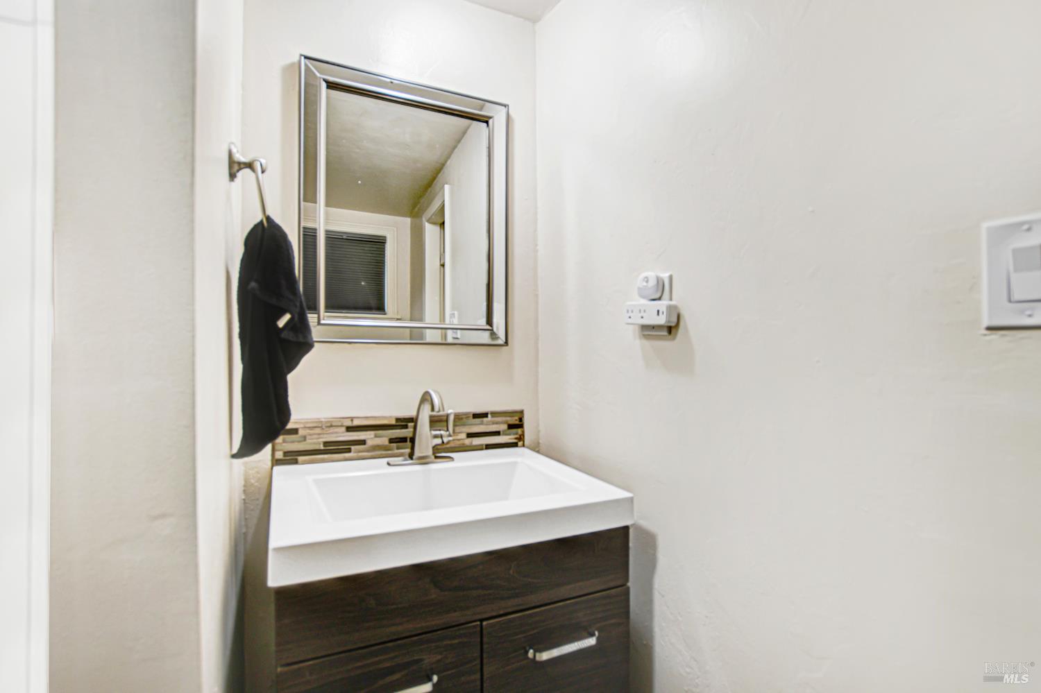 15289 Willow Road Guerneville, CA 95446 - Photo 19 of 22 a bathroom with a sink and a mirror