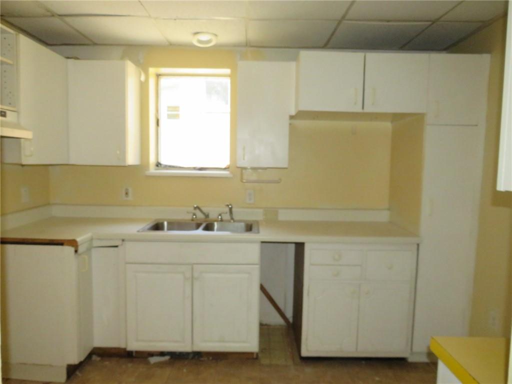 423 Braddock Road Pittsburgh, PA 15221 - Photo 11 of 36 a room with a sink and cabinets