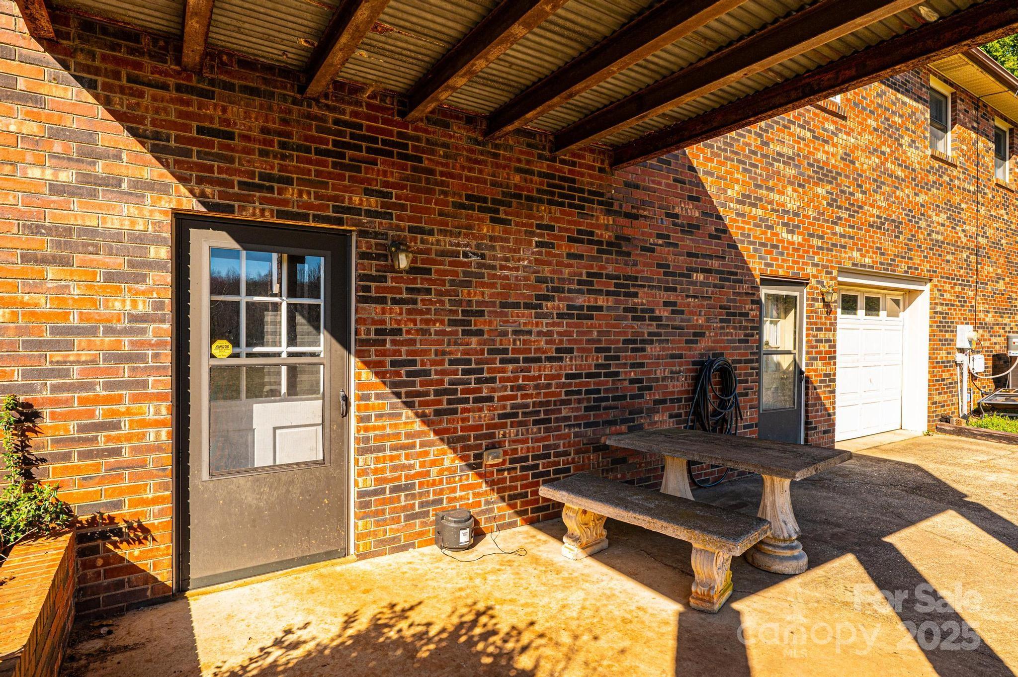 1221 Connelly Springs Road Lenoir, NC 28645 - Photo 15 of 42 a view of a porch with furniture