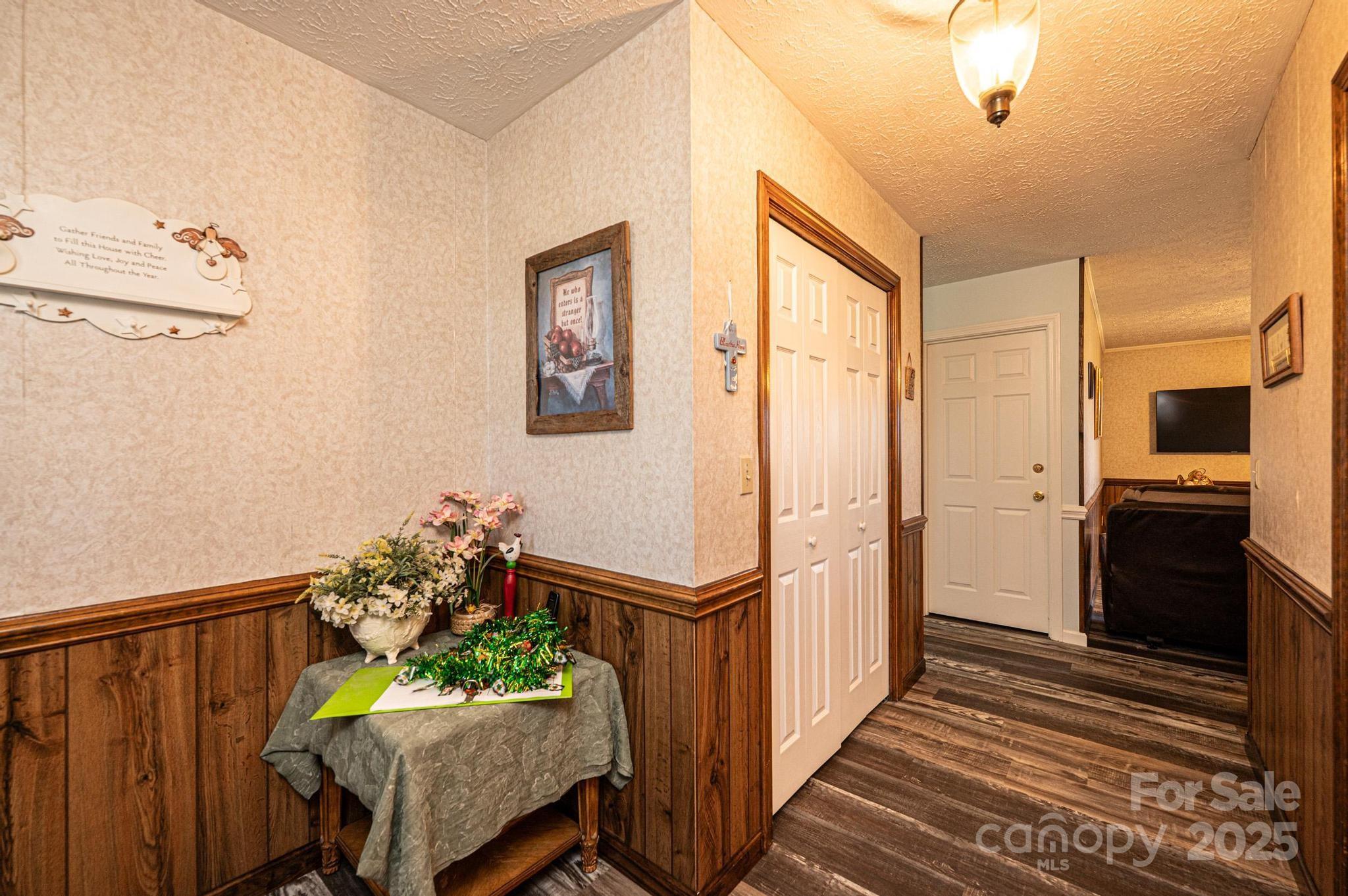 1221 Connelly Springs Road Lenoir, NC 28645 - Photo 16 of 42 a view of a hallway to a livingroom with furniture