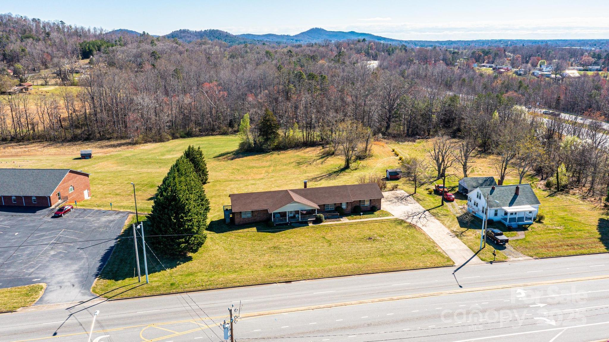 1221 Connelly Springs Road Lenoir, NC 28645 - Photo 2 of 42 a view of swimming pool with a lounge chairs