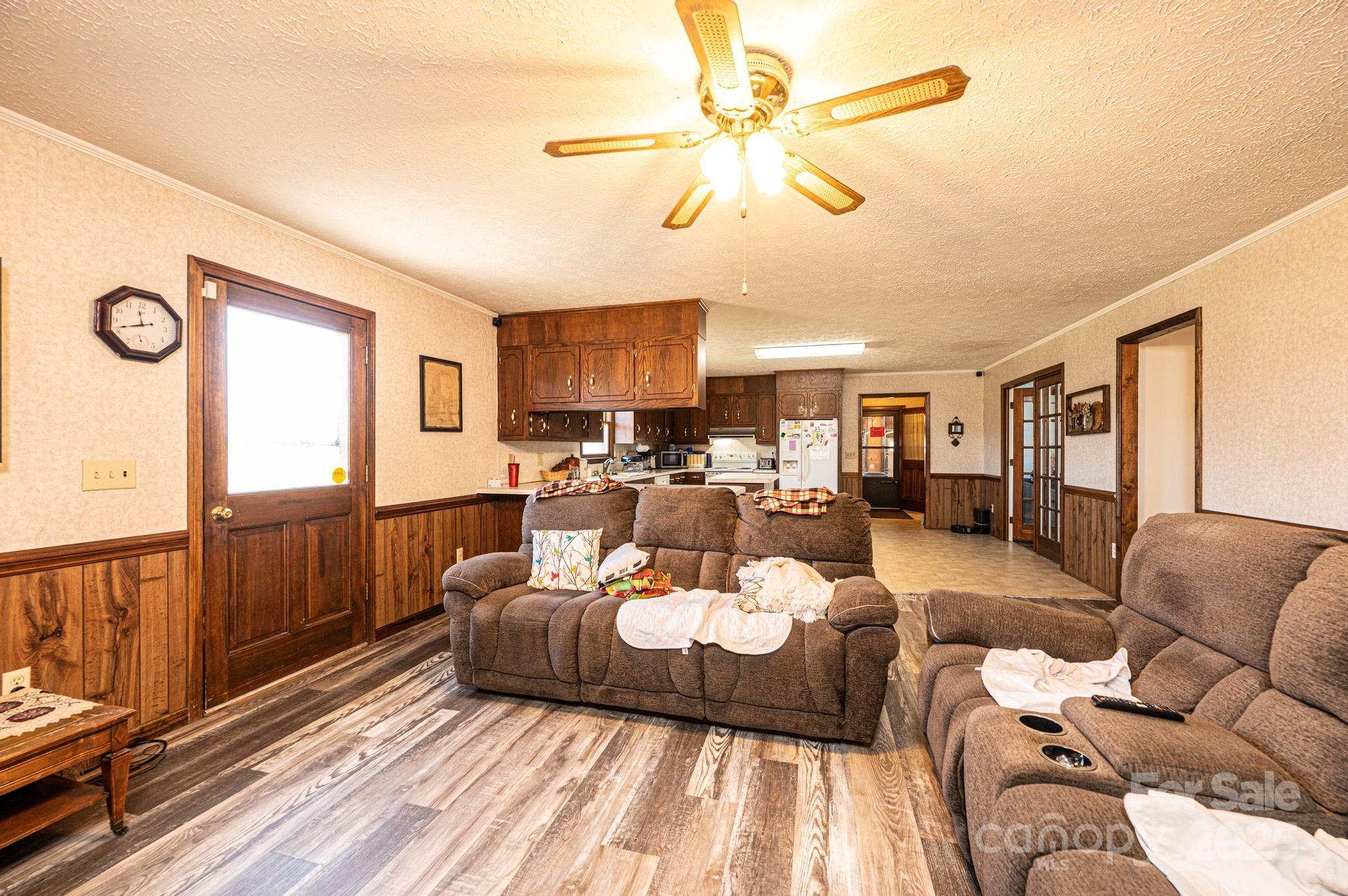1221 Connelly Springs Road Lenoir, NC 28645 - Photo 34 of 42 a living room with furniture and a large window