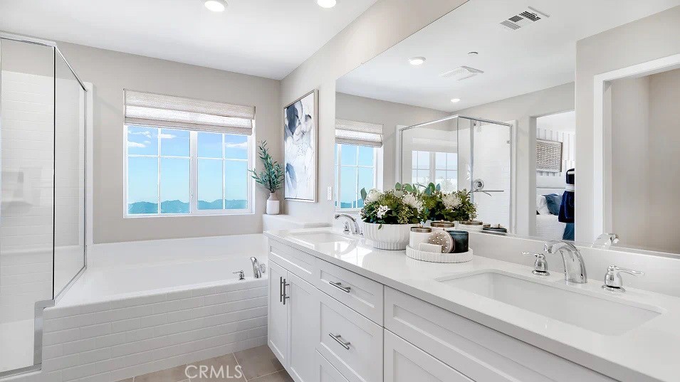 1708 Eagle Road Rialto, CA 92376 - Photo 17 of 23 a bathroom with a tub sink and mirror