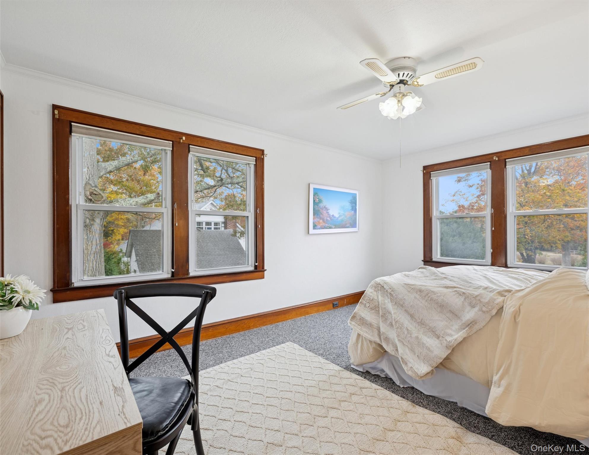 148 Woodhull Avenue Riverside, NY 11901 - Photo 17 of 20 a bedroom with a bed and wooden floor