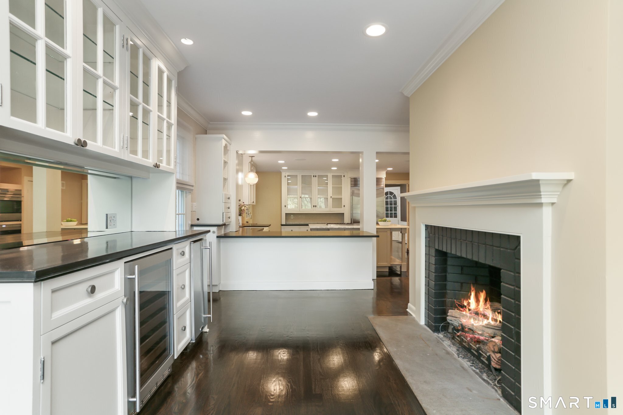 890 Silvermine Road New Canaan, CT 06840 - Photo 30 of 30 Enjoy the open floor plan with beverage bar and fireplace