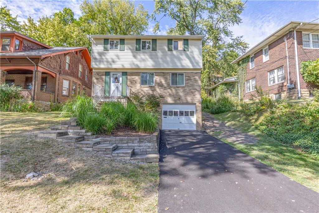 103 Cherry Valley Road Pittsburgh, PA 15221 - Photo 1 of 29 a view of a house with a yard
