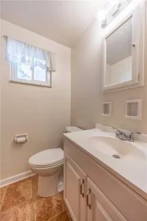 a bathroom with a sink and a toilet