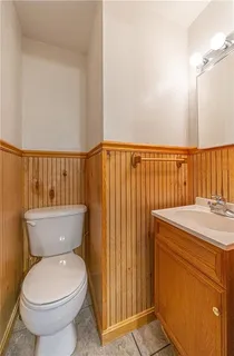 a bathroom with a toilet and a sink