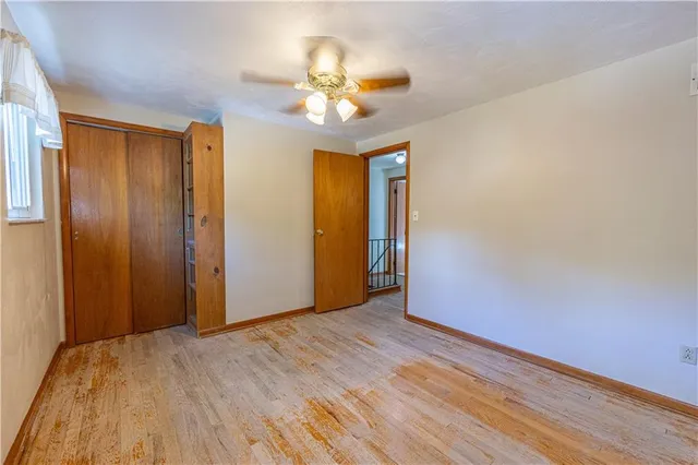 a view of a livingroom with a chandelier fan