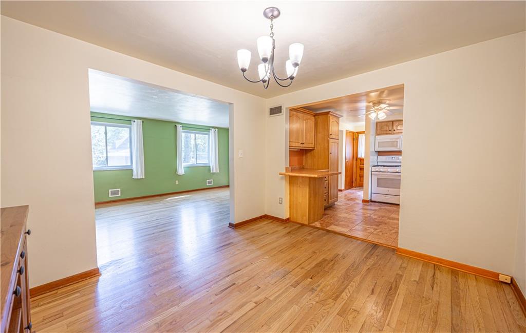 103 Cherry Valley Road Pittsburgh, PA 15221 - Photo 7 of 29 a view of an empty room with wooden floor and a window