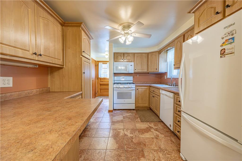103 Cherry Valley Road Pittsburgh, PA 15221 - Photo 8 of 29 a kitchen with cabinets and window