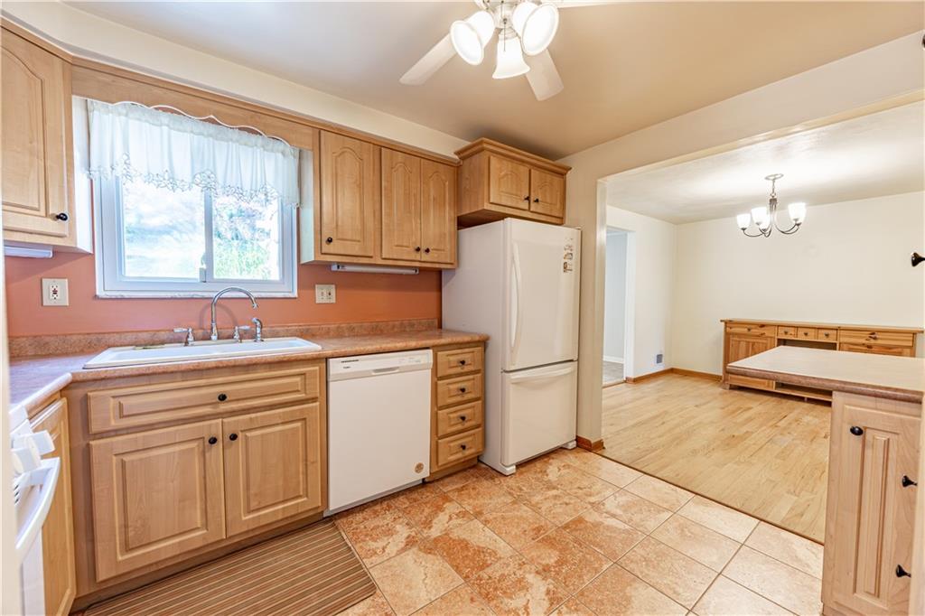 103 Cherry Valley Road Pittsburgh, PA 15221 - Photo 9 of 29 a kitchen with a refrigerator sink and cabinets